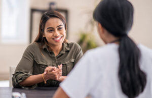 young women talking with one another