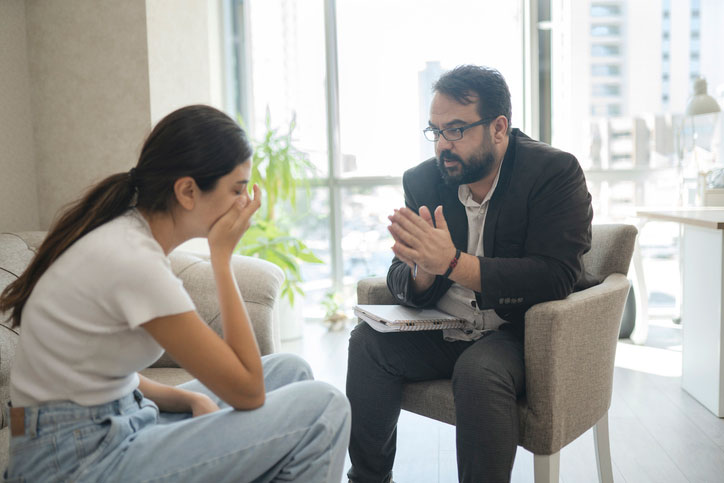 consoling upset female in counseling