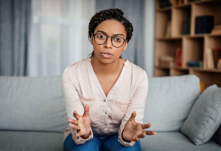 Serious therapist reviewing post-graduate addiction counseling certificate program materials representing advanced professional development for licensed mental health counselors and social workers