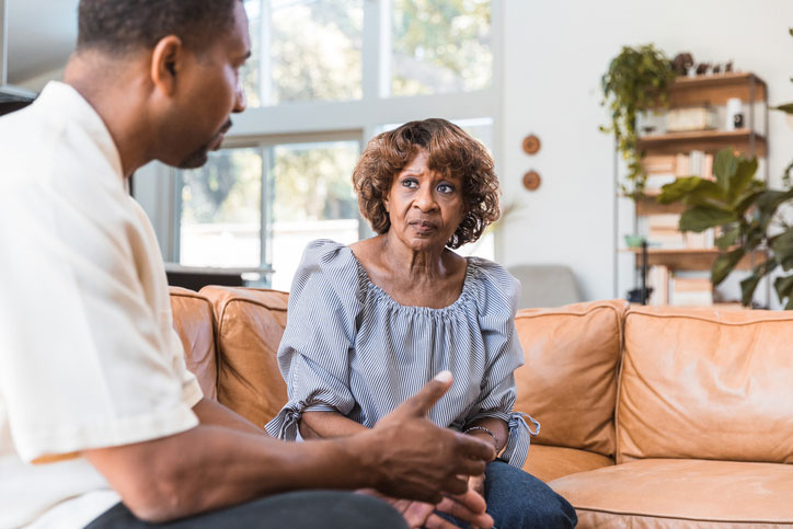 male counselor talking with senior woman