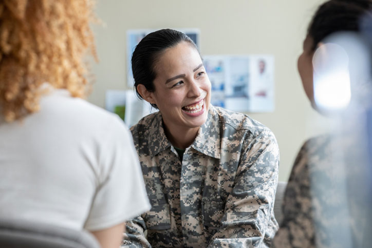 military woman talking with others