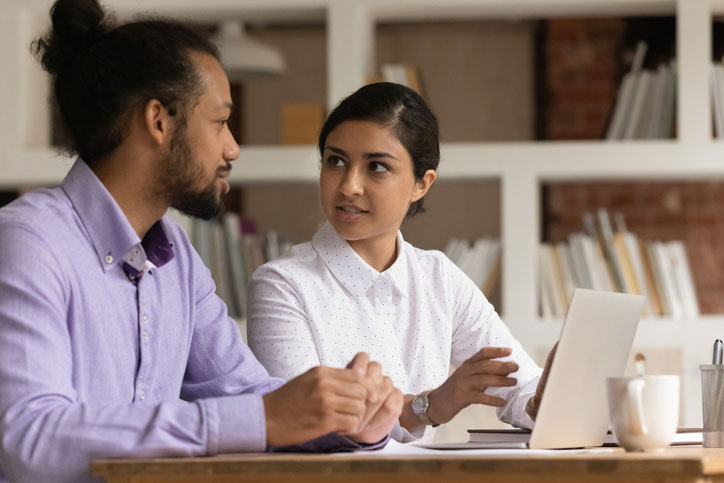 colleagues discussing in office