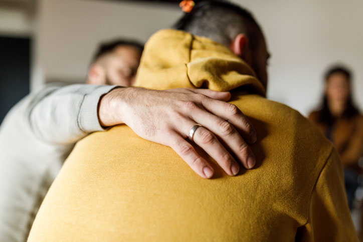 friends embracing after session