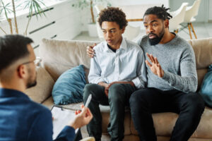 father and son in therapy together