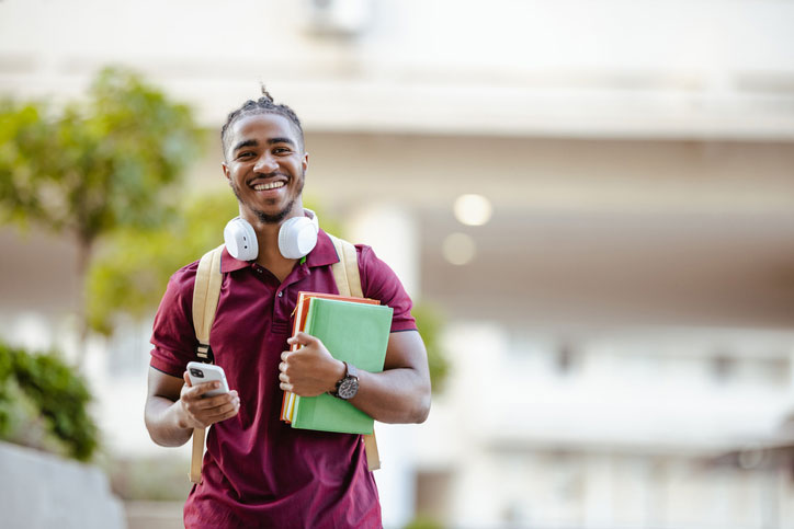 proud male student on campus