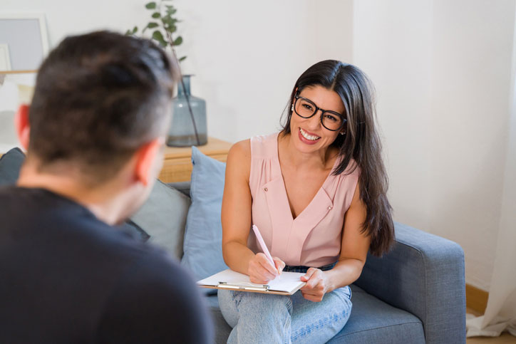 taking notes while talking with patient