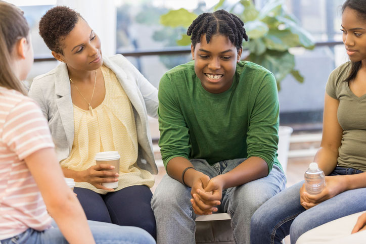 vulnerable teen boy in group session