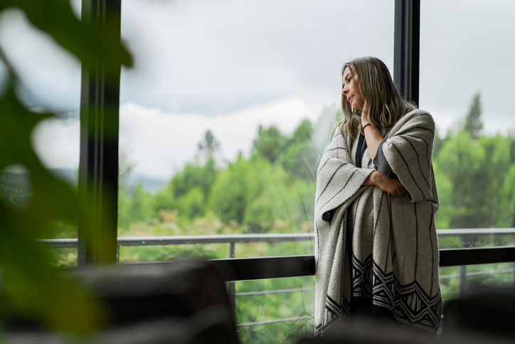 woman looking out the window