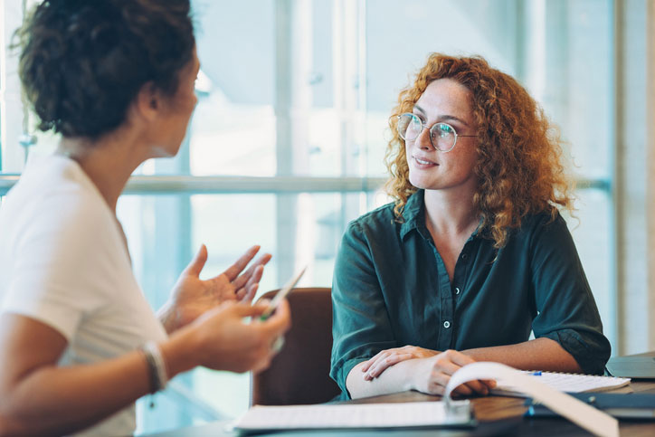 young counselor talking with colleague